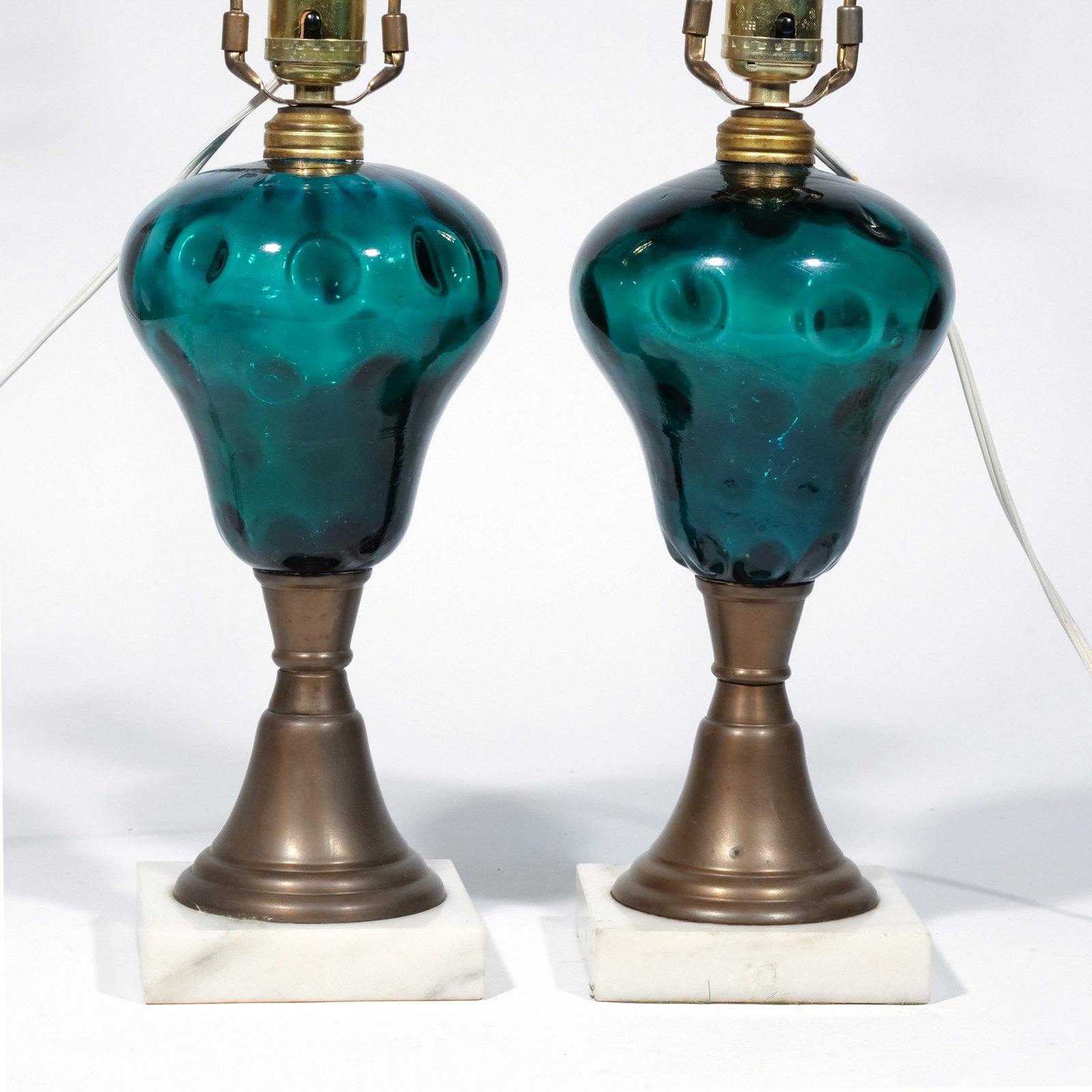 (2pc) PAIR of FOREST GREEN & BRASS FLUID LAMPS: Mounted on marble plinths, now electrified h. 12 w. 4-1/2 in. (base) overall: 12 x 24 in. Provenance: Landmark Hoyt Homestead, Pound Ridge, NY [In Situ Item] This item will not be on display in our sa