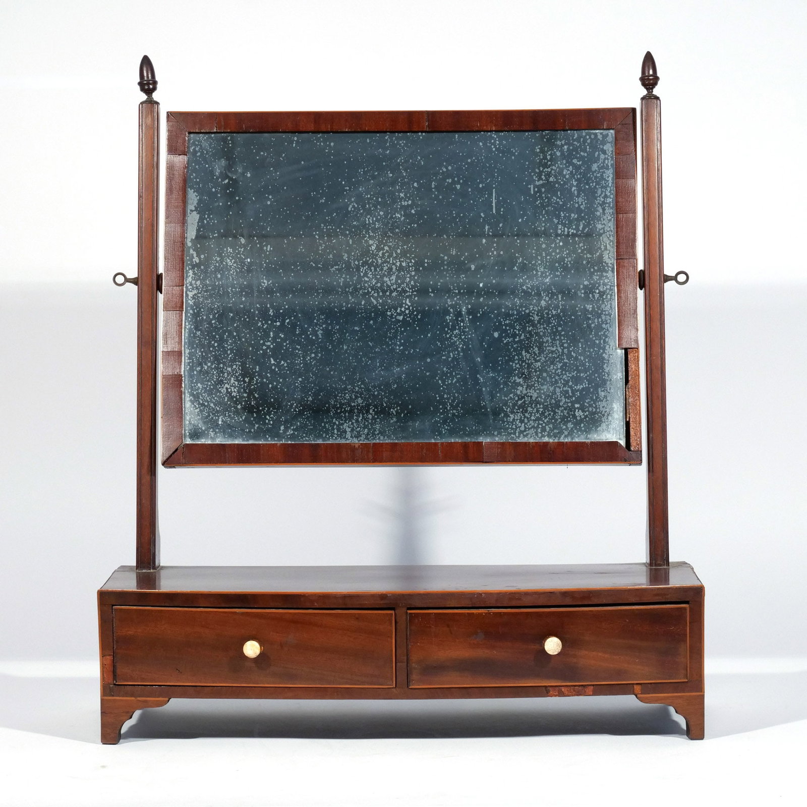 FEDERAL MAHOGANY DRESSING MIRROR: Early 19th century, having two drawers h. 24 w. 21 d. 8-1/2 in. Provenance: Descent through a prominent Greenwich, CT family [In Situ Item] This item will not be on display in our saleroom during our