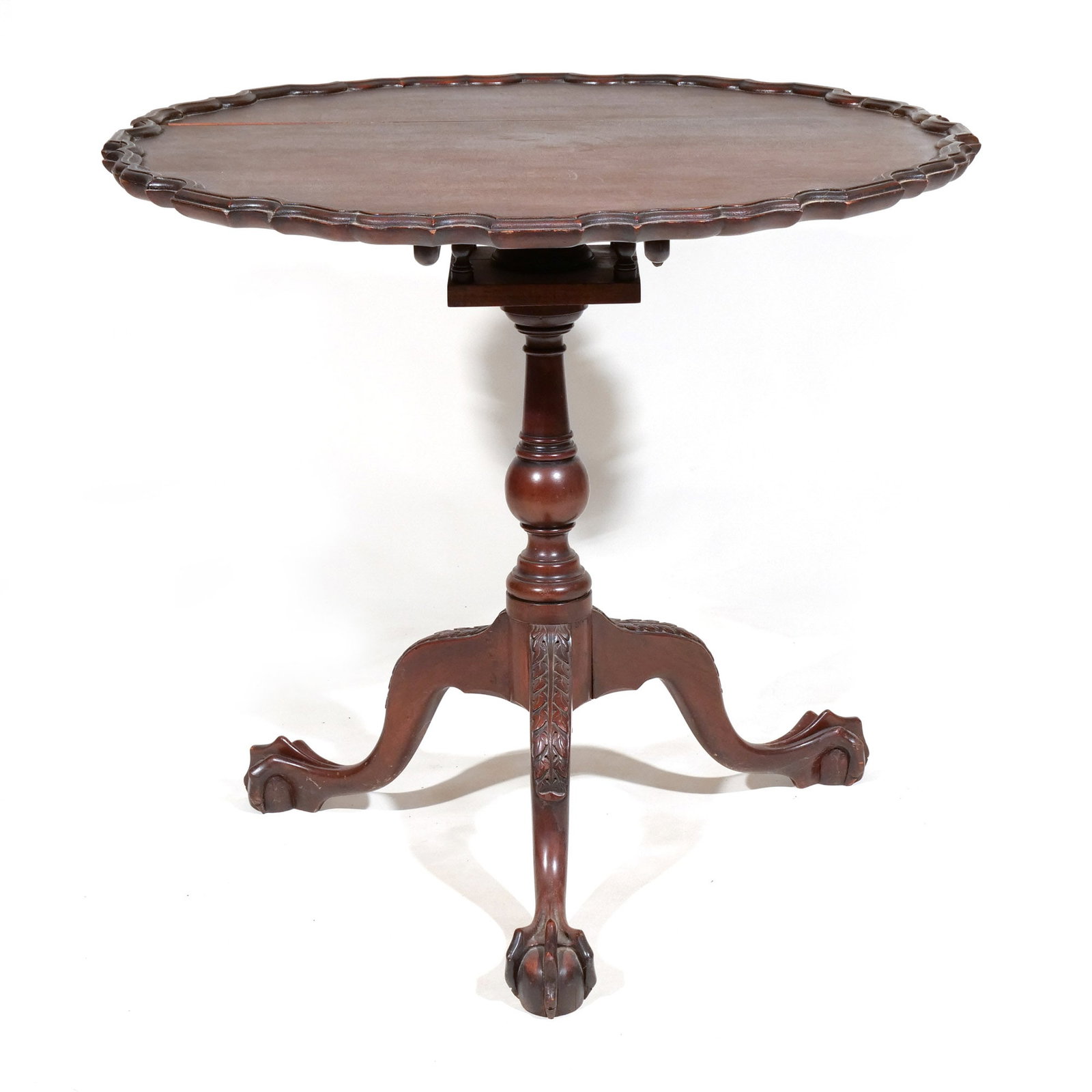MAHOGANY BIRD-CAGE TILT TOP TEA TABLE: Late 19th century, having pie crust top and ball and claw feet h. 29-1/2 w. 32-1/2 d. 32 in. Provenance: Descent through a prominent Greenwich, CT family