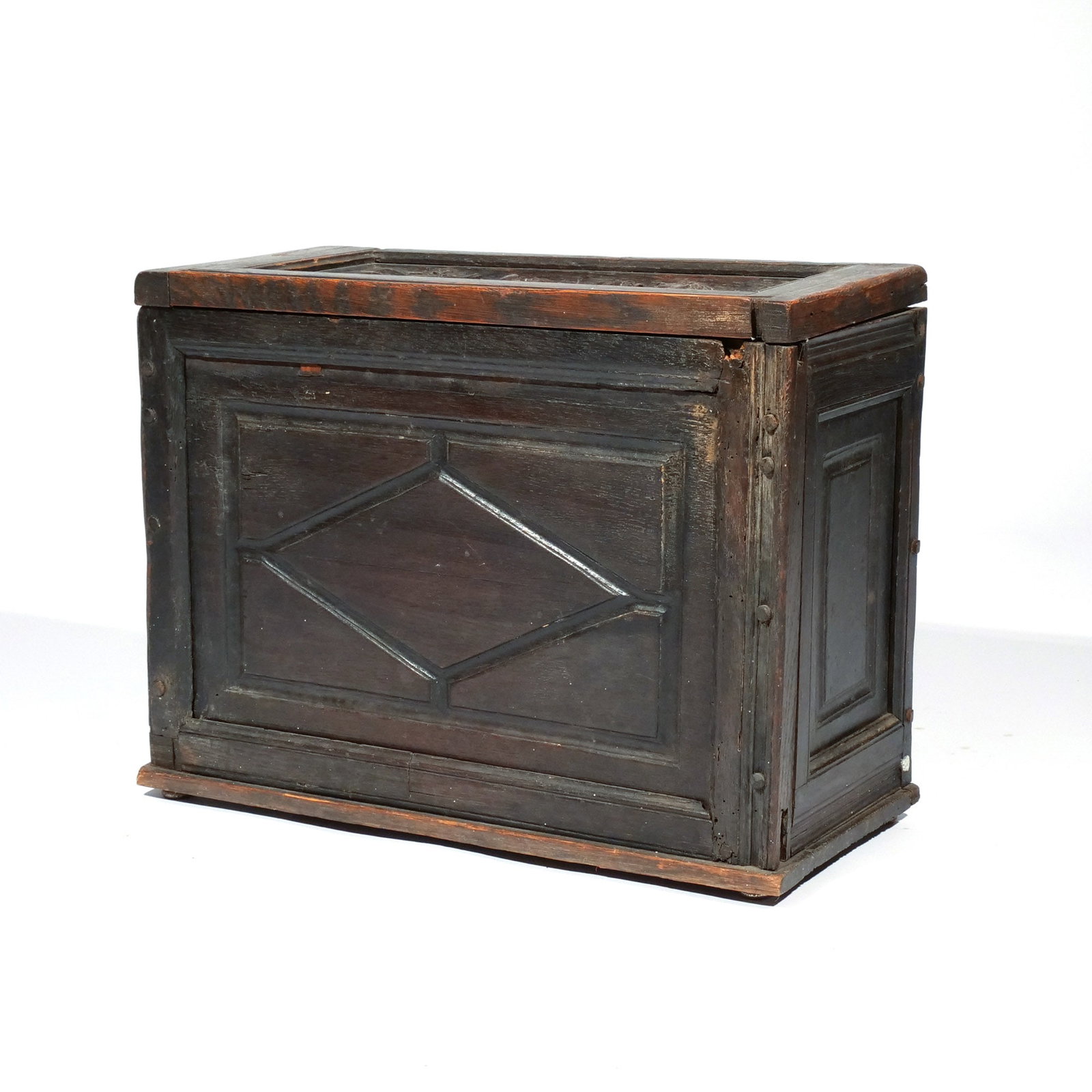 CONTINENTAL CARVED OAK BIBLE BOX: 18th century, the side-facing lid with relief carving of Daniel in the lions' den h. 14-1/2 w. 18-1/2 d. 9 in. Provenance: Descent through a prominent Greenwich, CT doctor's estate [In Situ Item]