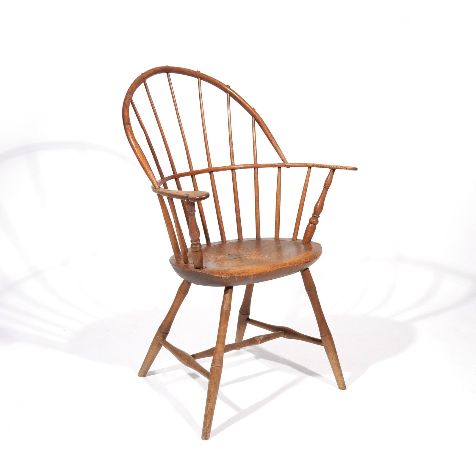 AMERICAN SACK BACK WINDSOR ARMCHAIR: 19th century h. 18 in. (seat) w. 26 d. 16 in. overall: 38 x 26 x 16 in. Provenance: Descent through a prominent Greenwich, CT doctor's estate [In Situ Item] This item will not be on display in our