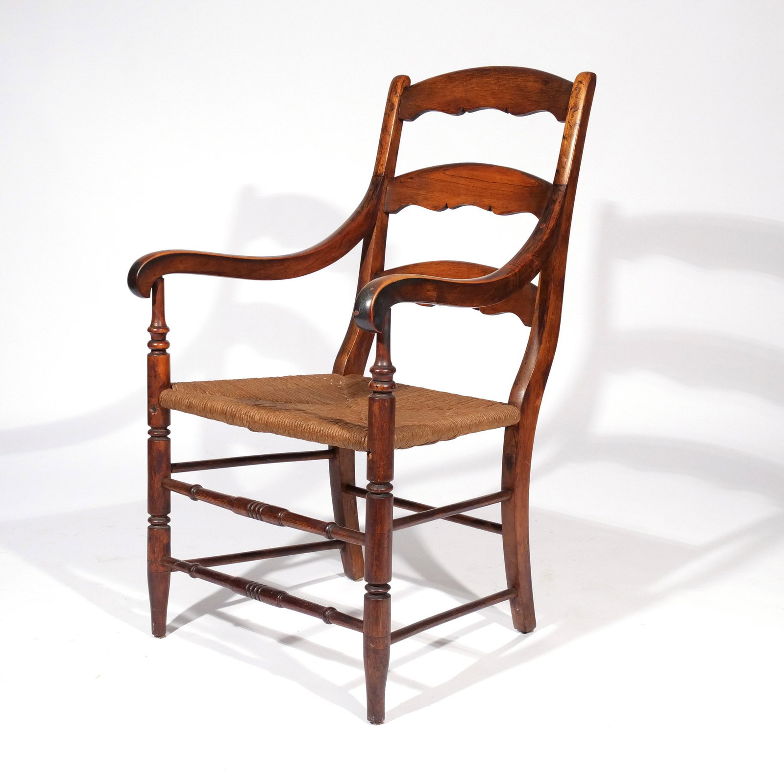 CONTINENTAL LADDERBACK ARMCHAIR: 19th century h. 17-1/2 in. (seat) w. 22 d. 17 in. overall: 38 x 22 x 17 in. Provenance: Landmark Hoyt Homestead, Pound Ridge, NY [In Situ Item] This item will not be on display in our saleroom during