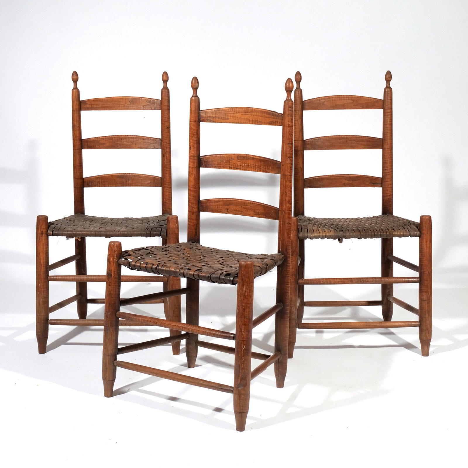 (3pc) AMERICAN TIGER MAPLE LADDER-BACK CHAIRS: 19th century h. 17 in. (seat) w. 18 d. 13-1/2 in. overall: 37-1/2 x 18 x 13-1/2 in. Provenance: Descent through a prominent Greenwich, CT doctor's estate [In Situ Item] This item will not be on