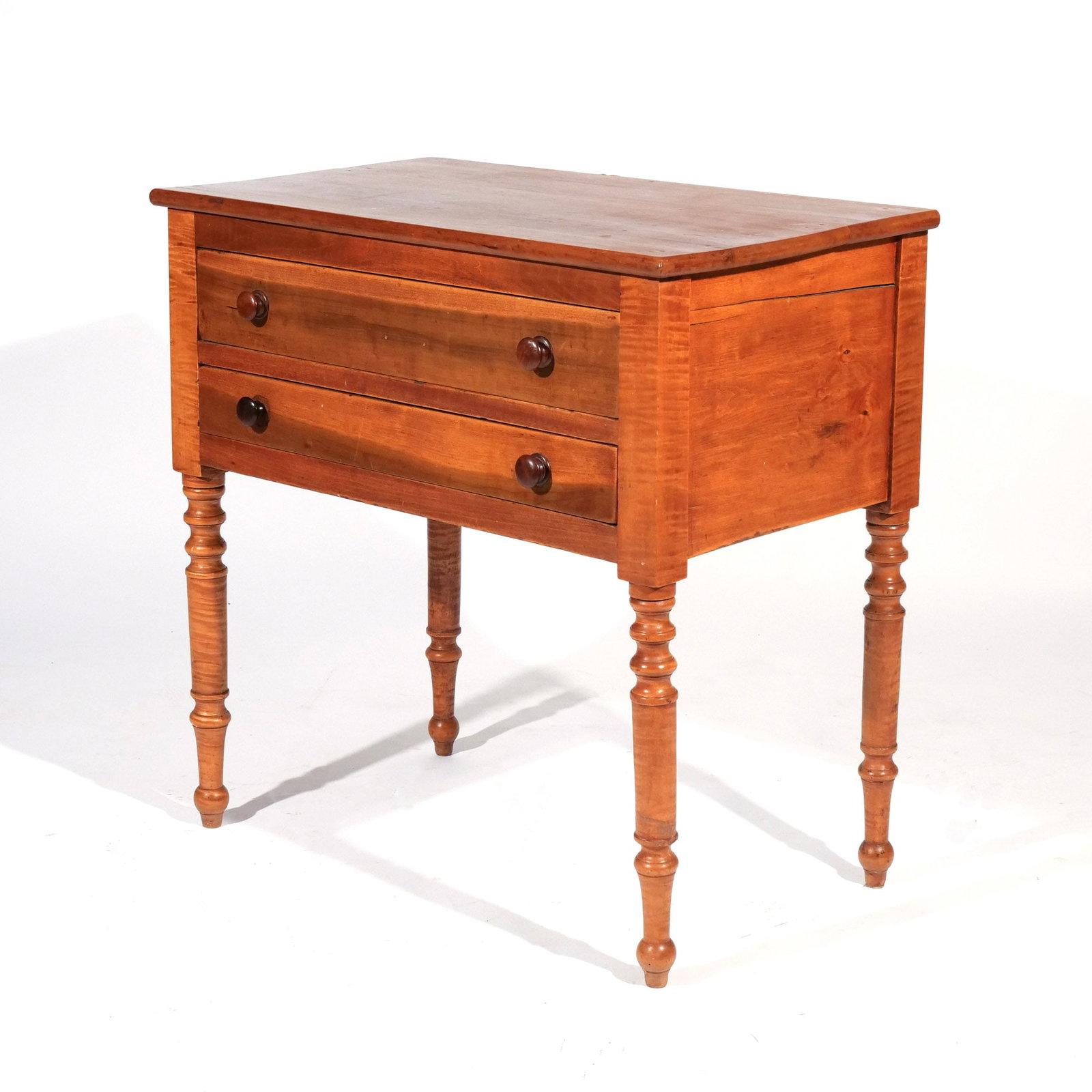 AMERICAN MAPLE TWO DRAWER WORKTABLE: Late 19th century, two-board top with tiger maple legs h. 29 w. 29 d. 17 in. Provenance: Descent through a prominent Greenwich, CT doctor's estate [In Situ Item] This item will not be on display in