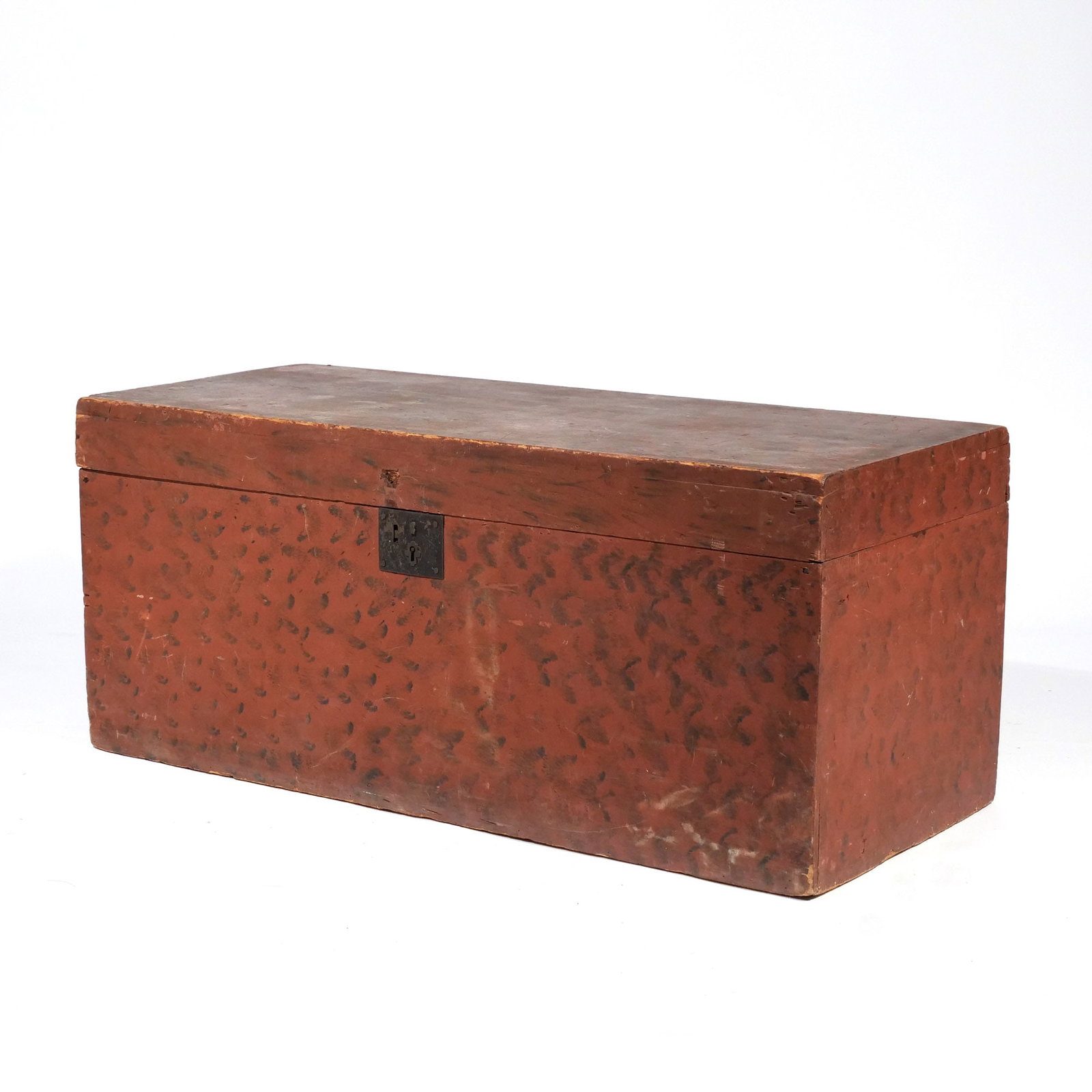 RED SPONGE-PAINTED STORAGE CHEST: 19th century, of rectangular shape with black sponge-painted design on a red ground h. 17-1/2 w. 43 d. 18 in. Provenance: Private collection, Bernardsville, NJ [In Situ Item] This item will not be on