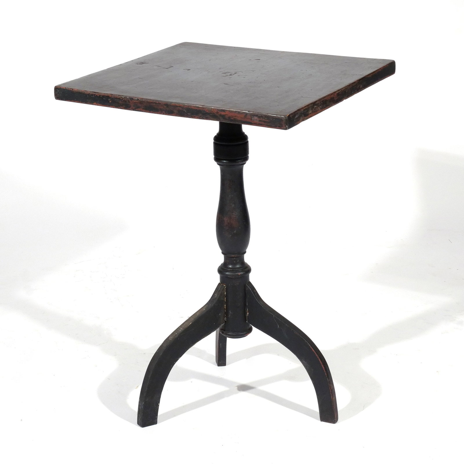 PAINTED COUNTRY TRIPOD CANDLESTAND: Early 19th century, having square top, mounted on turned post, resting on tripod spider legs h. 29 w. 20-1/4 in. Provenance: Landmark Hoyt Homestead, Pound Ridge, NY [In Situ Item] This item will not