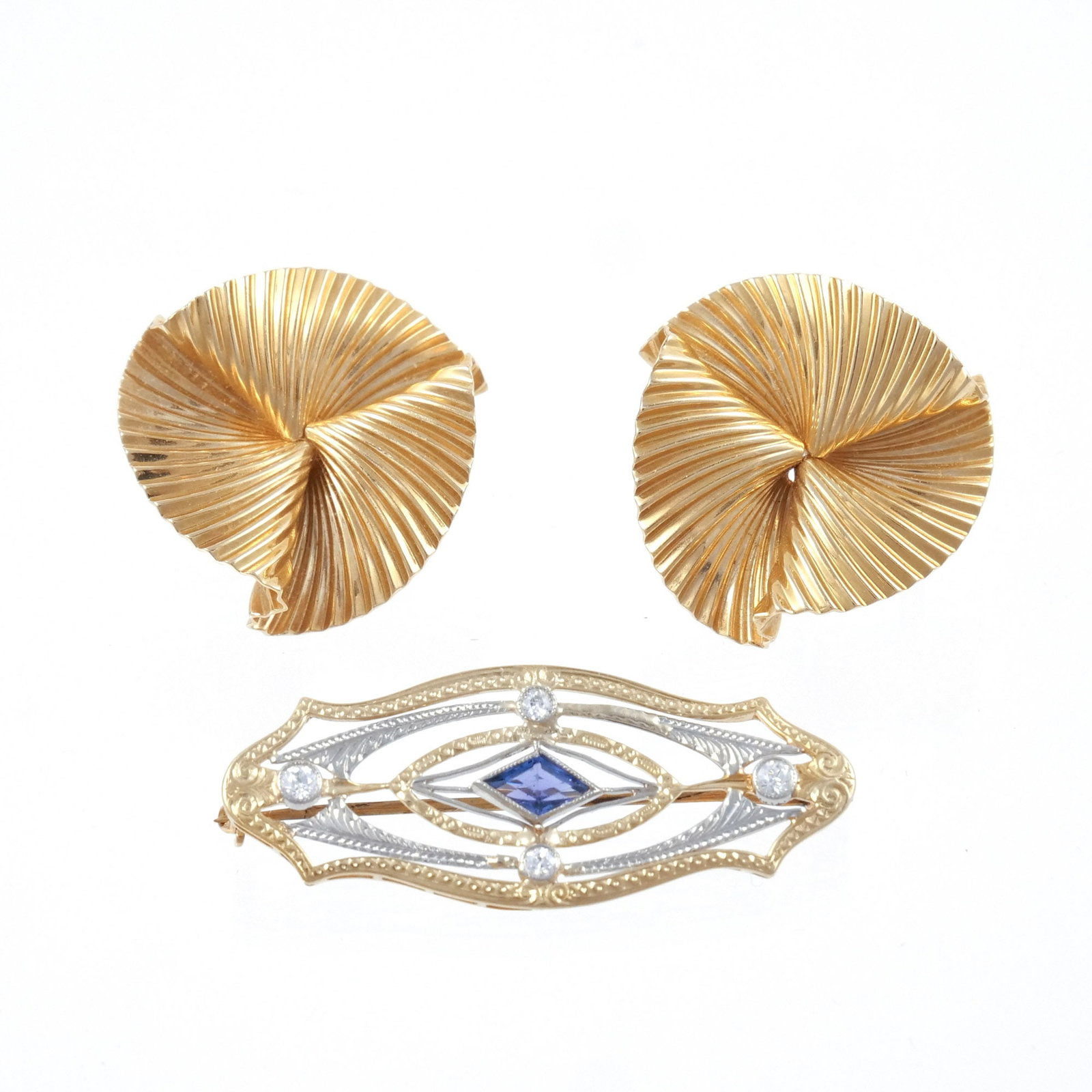 (3pc) 14K GOLD EAR CLIPS AND PIN: Comprising a pair of 14k gold fan or linen-fold clip-back earrings, marked '14k' and with unidentified maker's mark, 21mm x 23mm x 15mm; plus an unrelated pierced, cartouche-shaped pin in 14k white an