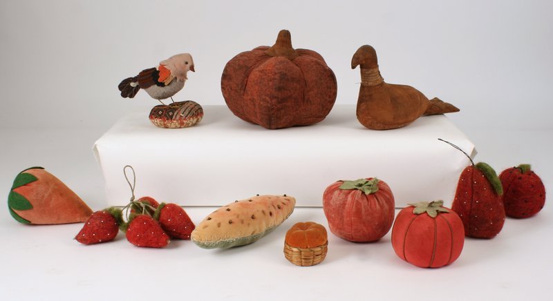 7) GROUP OF STUFFED ANIMALS & OBJECTS, 11 pieces: total, including a pumpkin (dia: 6 1/2"), a dove (sgd. & d. "2000"), a string of 4 strawberries, a large strawberry, 2 tomatoes, a chickadee on a stand, a sliver of watermelon, a small pumpkin in a ba