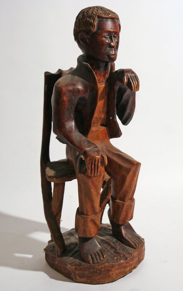 281) NAÏVE POLYCHROMED CARVING OF A BLACK MAN,: signed "Joe Freeman, Newark, 1936, h. 22 ½"