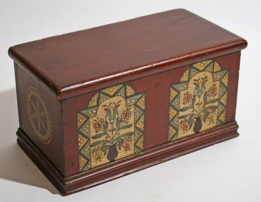 292A) 2 BOXES: 19TH C. SMALL STORAGE BOX with: Pennsylvania-Dutch painted floral sprays (later paint), H: 7 ¾" W: 15" D: 7 ½"; plus a rectangular flamed mahogany box, H: 6 ¼" W: 16" D: 7 ¾"