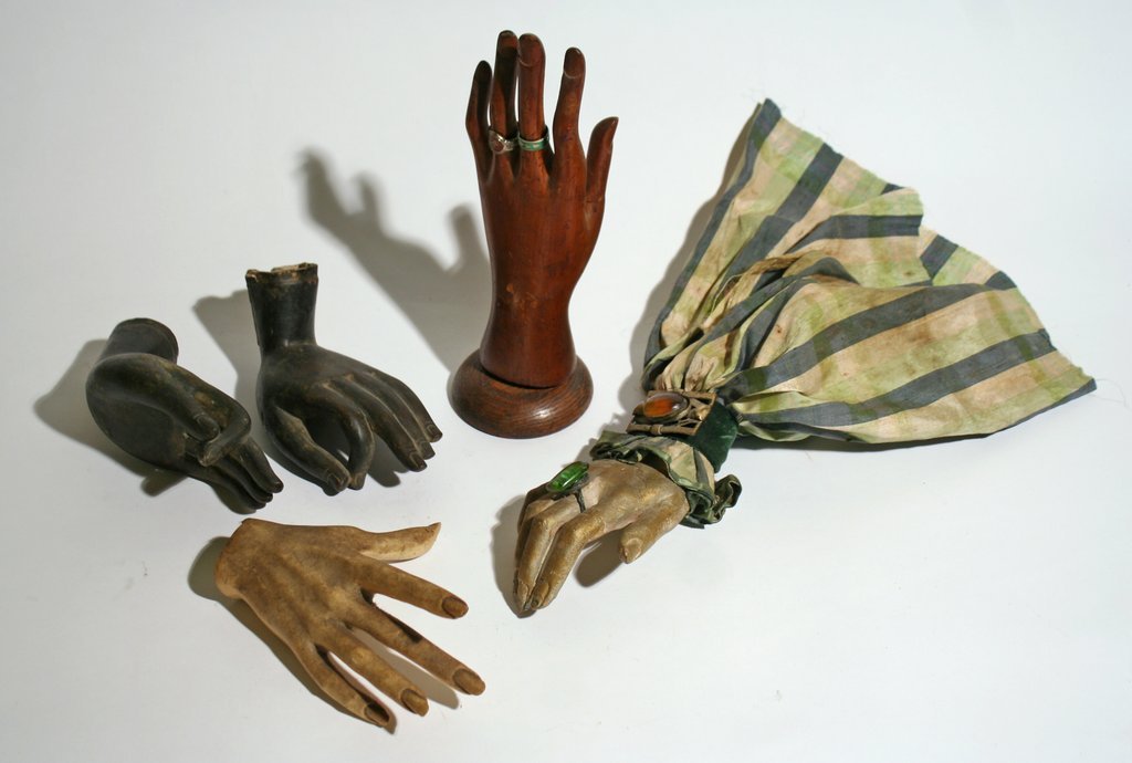 340) 5 HANDS: two in bronze, one carved wood, one: molded plastic, and one gilt plaster