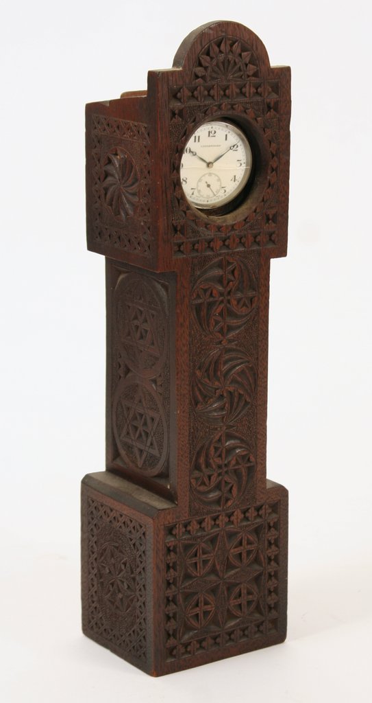 404) INCISED OAK WATCH HUTCH in the form of a tall: case clock, with middle eastern and Judaic motifs, H: 13 ¼"