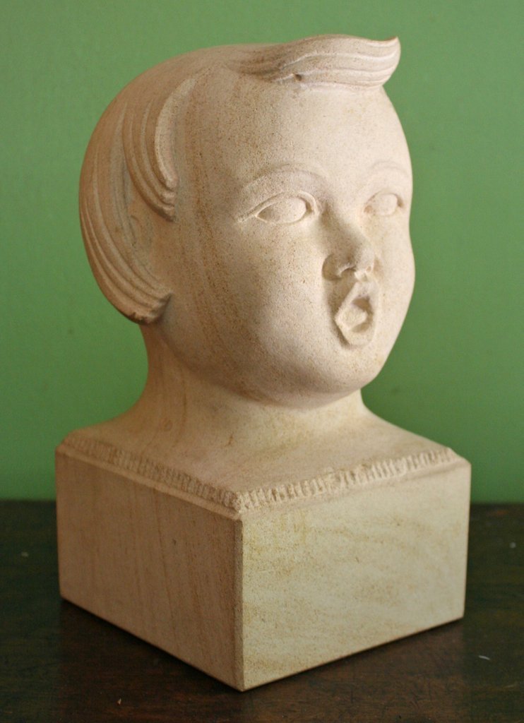 483) MICHAEL LUDWIG GRESSEL (American, 1902-2000),: Head of a Child, carved limestone, H: 10" 5 ¼" x 5 ¼"