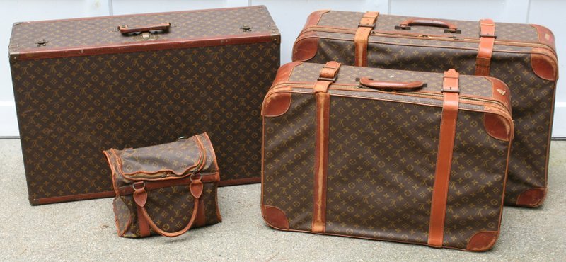 669) 4 PCS. LOUIS VUITTON LUGGAGE: one hard suitcase: 20 ½ x 31 ½ x 10", two soft suitcases, and one handbag, some with broken leather straps/overall wear