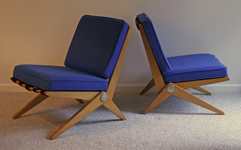 PAIR PIERRE JENNERET FOR KNOLL SCISSOR CHAIRS: maple with gilt steel discs and blue cushions, stamped "Insp Dec 1 195-", the upholstery with label dated 1963, h. 29" w. 23" d. 31"