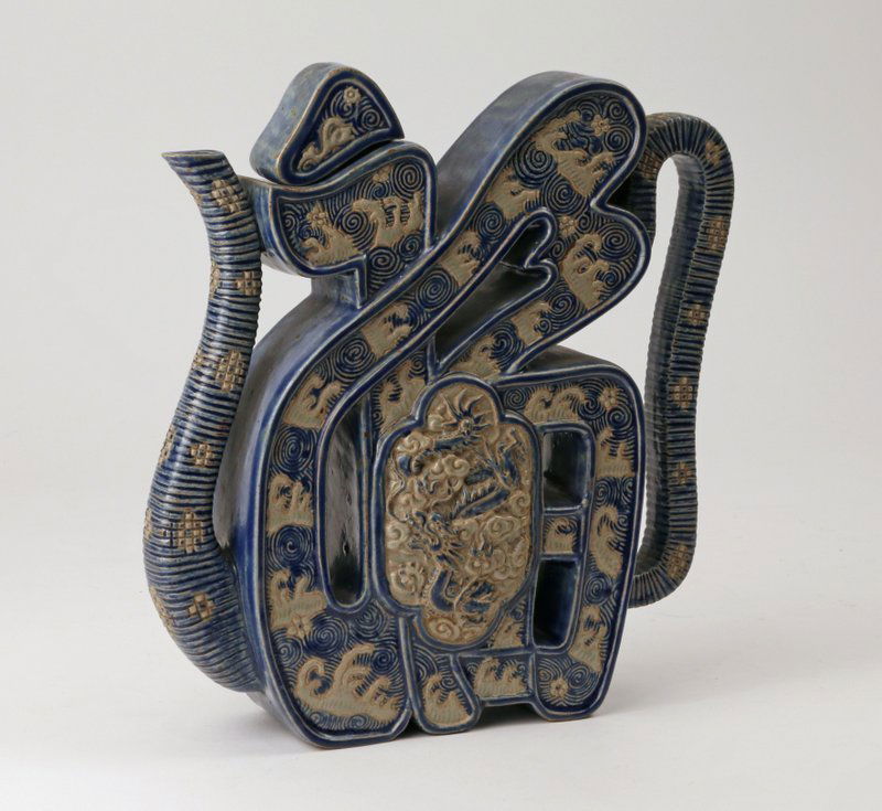 CHINESE EARTHENWARE TEA POT: of amorphous shape, h. 9" w. 9" d. 2 ½"