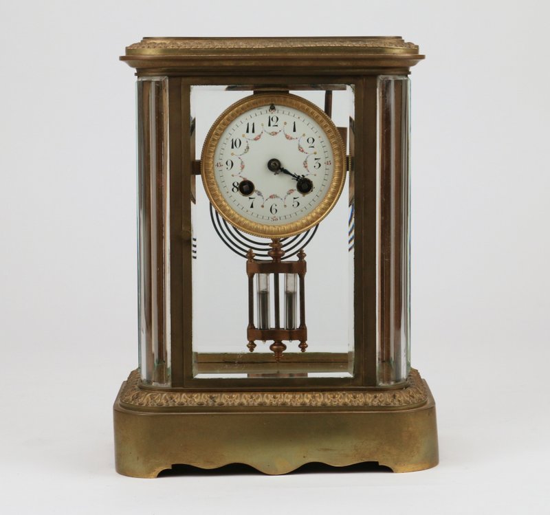 FRENCH ORMOLU SHELF CLOCK FOR TIFFANY & CO: by Samuel Marti, Paris, 1900, with paneled glass sides, h. 11" w. 8 ¼" d. 5", the minute hand broken but present