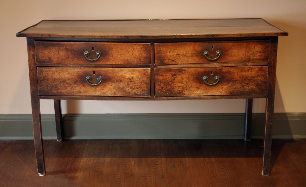 18TH C. PROVINCIAL ENGLISH SIDEBOARD: with 2 short drawers above 2 more short drawers, having minor worm damage and a split on one side; H: 34 1/2" W: 60 1/2" D: 27"