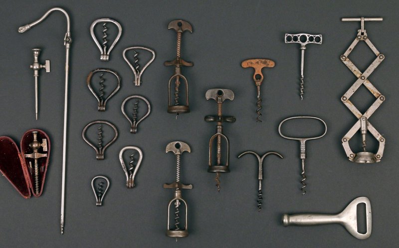 24 ANTIQUE WOODEN-HANDLE CORKSCREWS,: mostly English, 19th and early 20th Century, including 2 Williamson's, pat. 1897, 1 German spring barrel, 1 two-prong cork extractor, 1 rack and pinion, 7 simple pulls with turned handles, 4 with brus