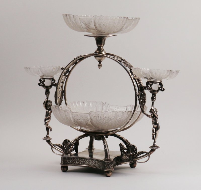VICTORIAN SILVER PLATED EPERGNE: by Meridan B. Company, with four cut crystal trays, stamped "Quadruple plate", overall h. 18", w. 19", d. 10"