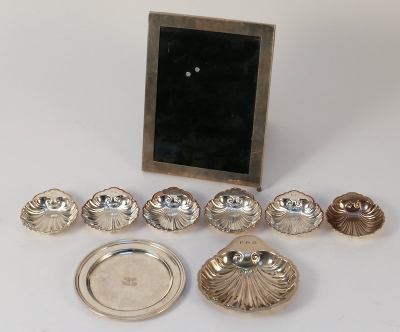 MISC. STERLING SILVER LOT: including 6 Gorham shell-form nut dishes, 1 similar nut dish (larger), 1 Tiffany coaster (broken), and 1 picture frame (8 ½" x 6 ½"), tot. weighable silver: 12 toz