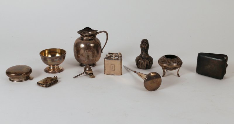 10 PCS. SMALL STERLING SILVER HOLLOWARE: including 1 creamer (3"), 1 open salt, 1 footed bowl, 1 salt shaker, 1 match book holder, 1 ice pick, 1 Tiffany for Dunhill lighter, 1 lid, 1 mini flask, and 1 small funnel, approx. 12 toz