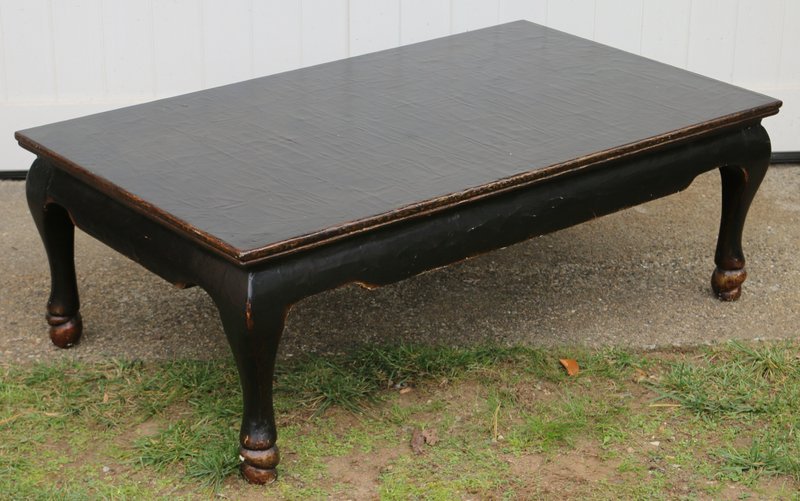 BLACK PARCEL GILT LACQUERED COFFEE TABLE,: Contemporary, in the Chinese taste with hoof feet, mkd. Therien Studio Workshops; h. 18" w. 53" d. 31½"