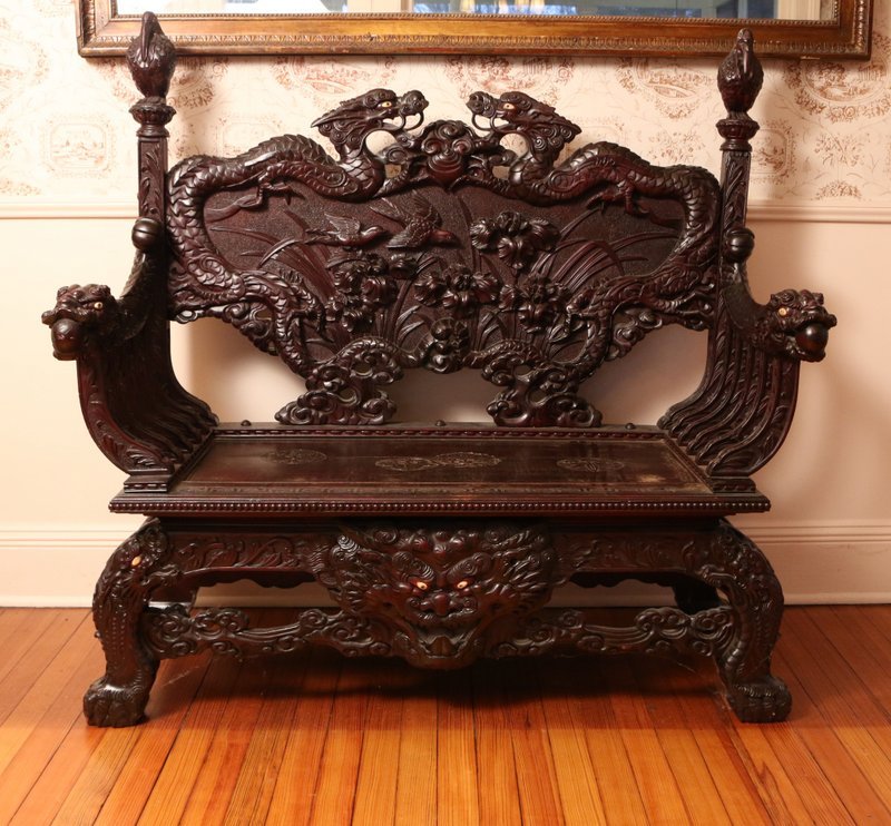 HEAVILY CARVED CHINESE HARDWOOD SETTEE: .