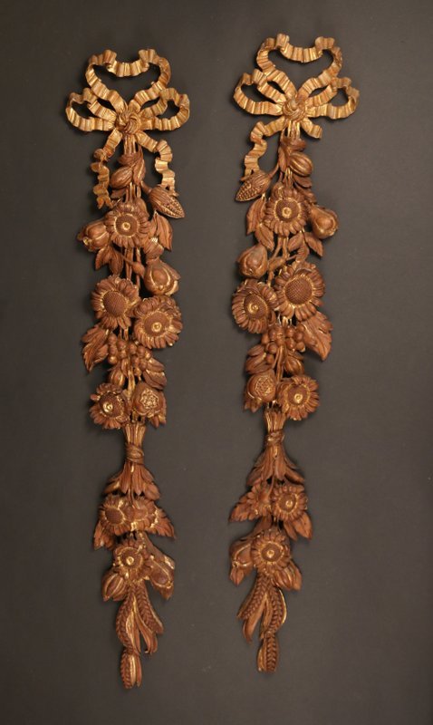 PAIR GILT-CARVED 20TH C. WALL APPLIQUES: of fruit and floral design, length: 41", one with a few minor repairs