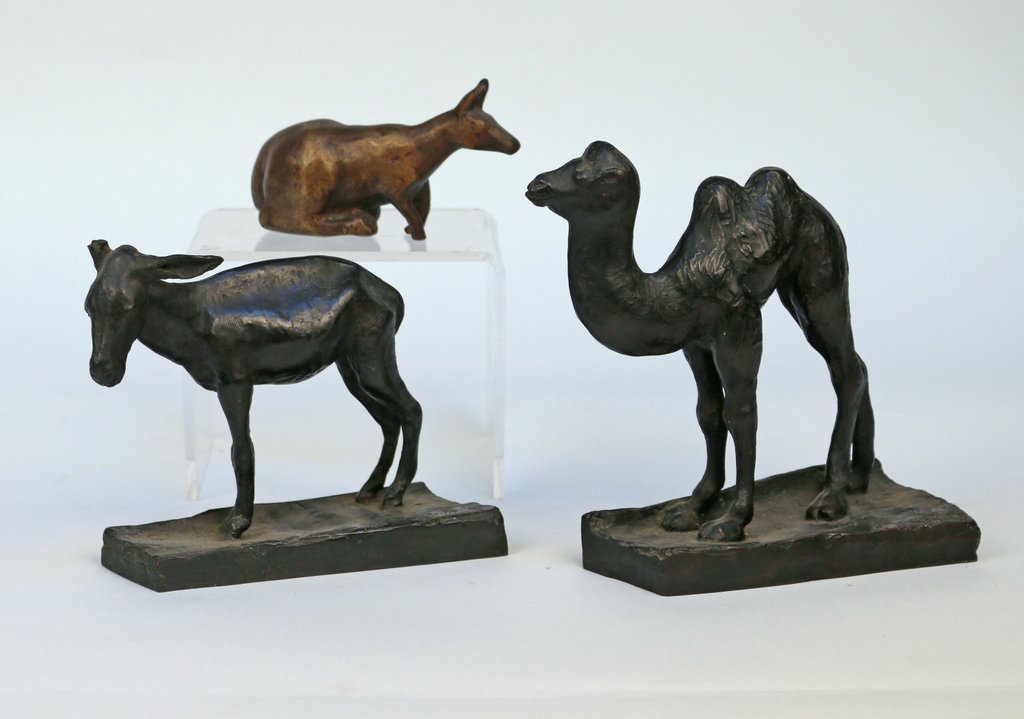 THREE BRONZE ANIMAL FIGURES: including a camel, a goat, and a crouching kangaroo, the camel and goat both signed 'C. A. Davis Jr.' and 'American Art Foundry, New York', 6 ¾ x 7 x 3” (the camel), the donkey missing an ear, the 
