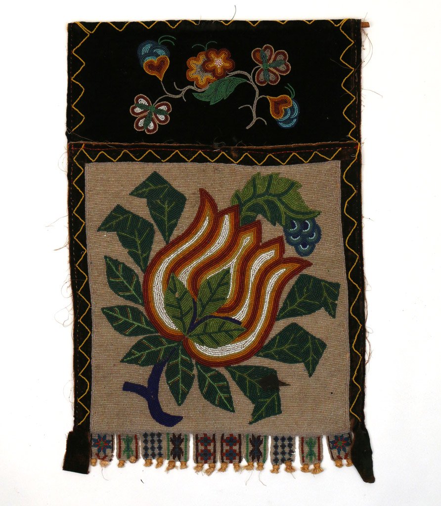 BEADED NATIVE AMERICAN BANDOLIER: circa 1880-1900, having overall beadwork with floral motifs, 20" x 13"
