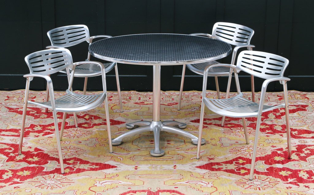 JORGE PENSI PEDESTAL TABLE AND FOUR ARMCHAIRS: For Toledo Design (Spain); Molded aluminum and steel; table h. 29.5" dia. 34"; chairs h. 30" w. 22" d.22"