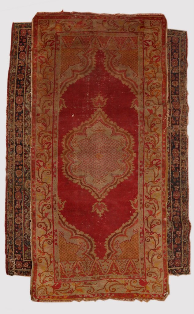 TWO ANTIQUE RUGS: Including a Lavar Kirman with an overall pattern and a red field, 5' 9” x 4' 5”; and a Turkish long rug with a red field and yellow highlights, 6' 8” x 3' 3”