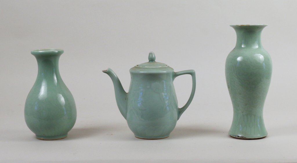 (3pc) CHINESE CELADON GLAZE EARTHENWARE: Including a vase of baluster shape (drilled), a teapot, and a bottle-neck vase, height range: 7 ¼” - 9 ½”