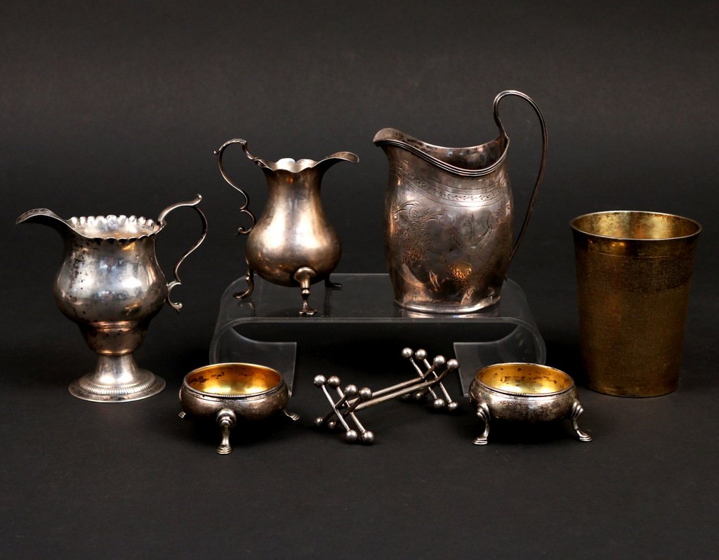 (8pc) GEORGIAN SILVER & OTHER: comprised of three creamers, two open salts, one beaker, and two knife rests, including a 4" creamer raised on three feet, circa 1760, maker's mark 'C - D' in an oval; a 4 1/2" round footed creamer, n