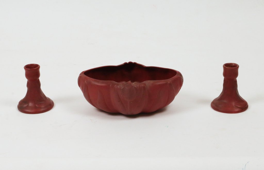 (3pc) VAN BRIGGLE POTTERY: All in mulberry, including a bulb pot with conforming stem holder, h. 3" w. 8 1/2"; and a pair of candlesticks, h. 3 1/2"; Provenance: Christie's East, sale 12/8/1993, lot 1035