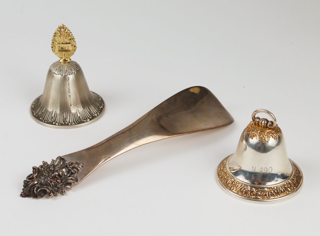 (3pc) BUCCELLATI STERLING: including a shoe horn with a satyr terminal, 4 toz, l. 9", mkd. Buccellati; plus two dinner bells, tallest: 3 1/4", both mkd., tot. wgt. bells: 4 toz