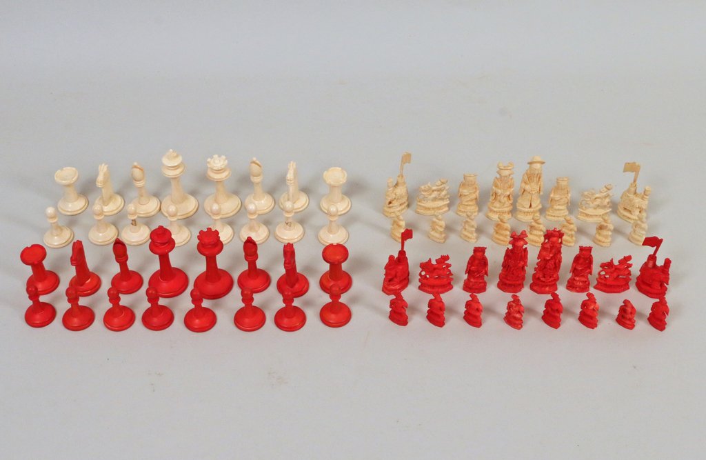 LOT OF ANTIQUE CARVED CHESS PIECES: 19th and early 20th Centuries, including a Chinese stained bone set (complete); a Georgian style set carved in bone (complete); and 24 various Chinese stained bone/boxwood pieces; height range: 1 1/4"