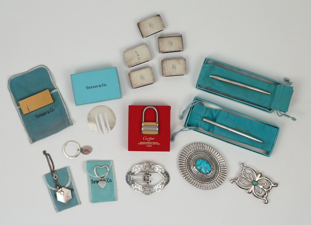 GROUP OF SILVER JEWELRY & OTHER: including: a Must de Cartier key ring, two Tiffany & Co. sterling and gilt sterling pens, a Tiffany & Co. sterling bookmark, three Tiffany & Co. key rings, a Tiffany & Co. pill box, a Tiffany & Co. gi