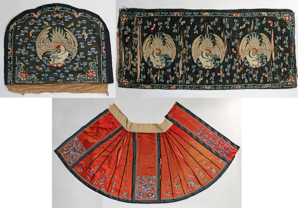 (3pc) ANTIQUE CHINESE SILK EMBROIDERY: including a long black banner interspersed with three pelicans and cloud motifs, 6' 2" x 2' 9" (with separations and damage); a matching throne cover, 2' 5" x 3' 2"; and an apron skirt with a red grou