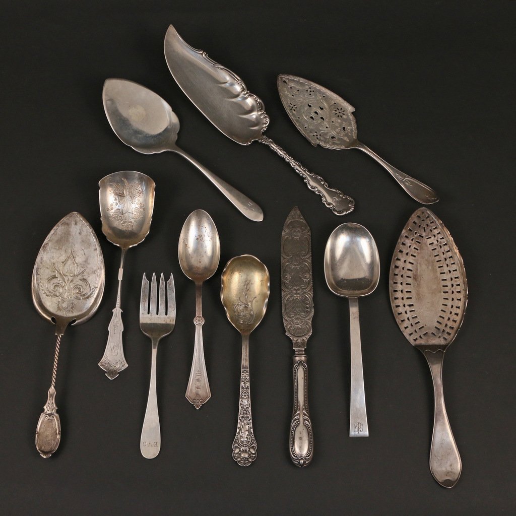 (11pc) SILVER SERVING PIECES: Incl. a Gorham chased and gilt-lined serving spoon; a Gorham serving spoon with an acorn finial; a French fish knife with a chased silver blade; an international sterling spoon; a "David Carlson" cold