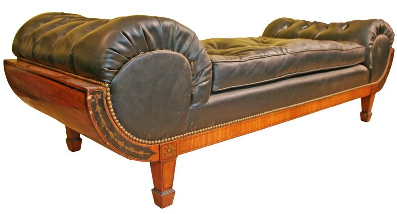 CONTINENTAL SATINWOOD & LEATHER DAYBED: with polychrome decoration, the tufted scrolled ends with conforming black reserves of gold bell-flowering supported on square tapering legs ending in spade feet, with modern imitation-leather upholst