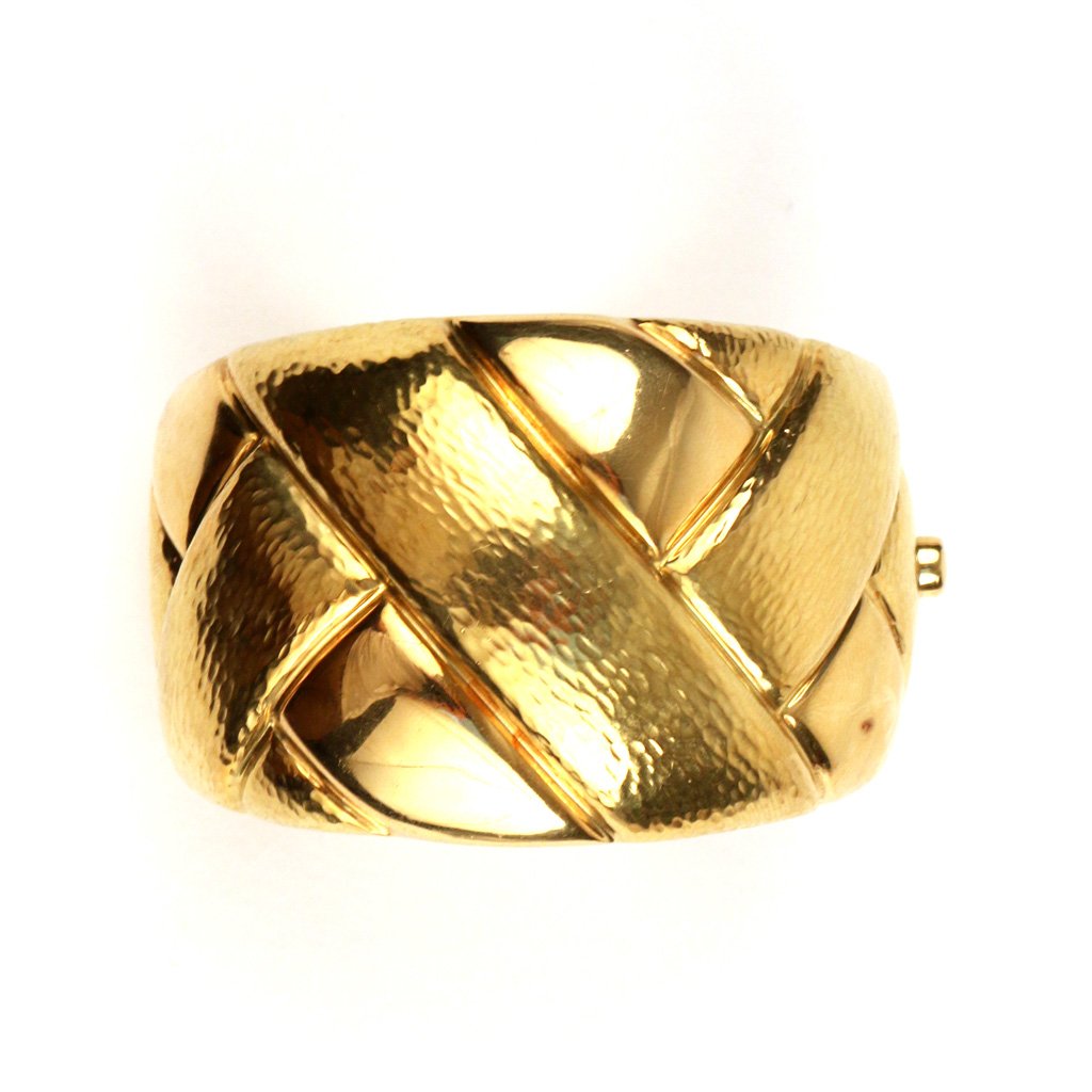 18k ITALIAN YELLOW GOLD BANGLE: of a strapwork design, 1 7/8 in. at its widest, mkd. 'Italy 750 18K 418 AL', 107 gms