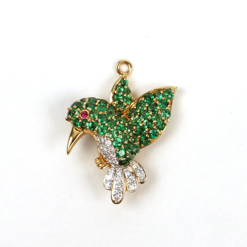 18k GOLD, TSAVORITE & DIAMOND BROOCH: Humming bird design, also can be worn as a pendant, approx. 1 1/4 in. high, mkd. '18k', 7.1 gms; Provenance: Sotheby's Arcade Jewelry, June 8, 1999, lot 97; Purchased by the present owner from the abo