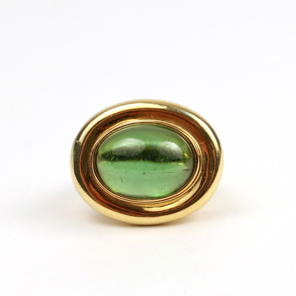 PALOMA PICASSO FOR TIFFANY & CO.: 18k gold and tourmaline ring, signed 'Paloma Picasso 750 / Tiffany & Co.', with a central cabochon tourmaline, size 5 1/2, 12.7 gms; Provenance: Sotheby's Arcade Jewelry, Dec. 7, 1998, lot 34; Purchas