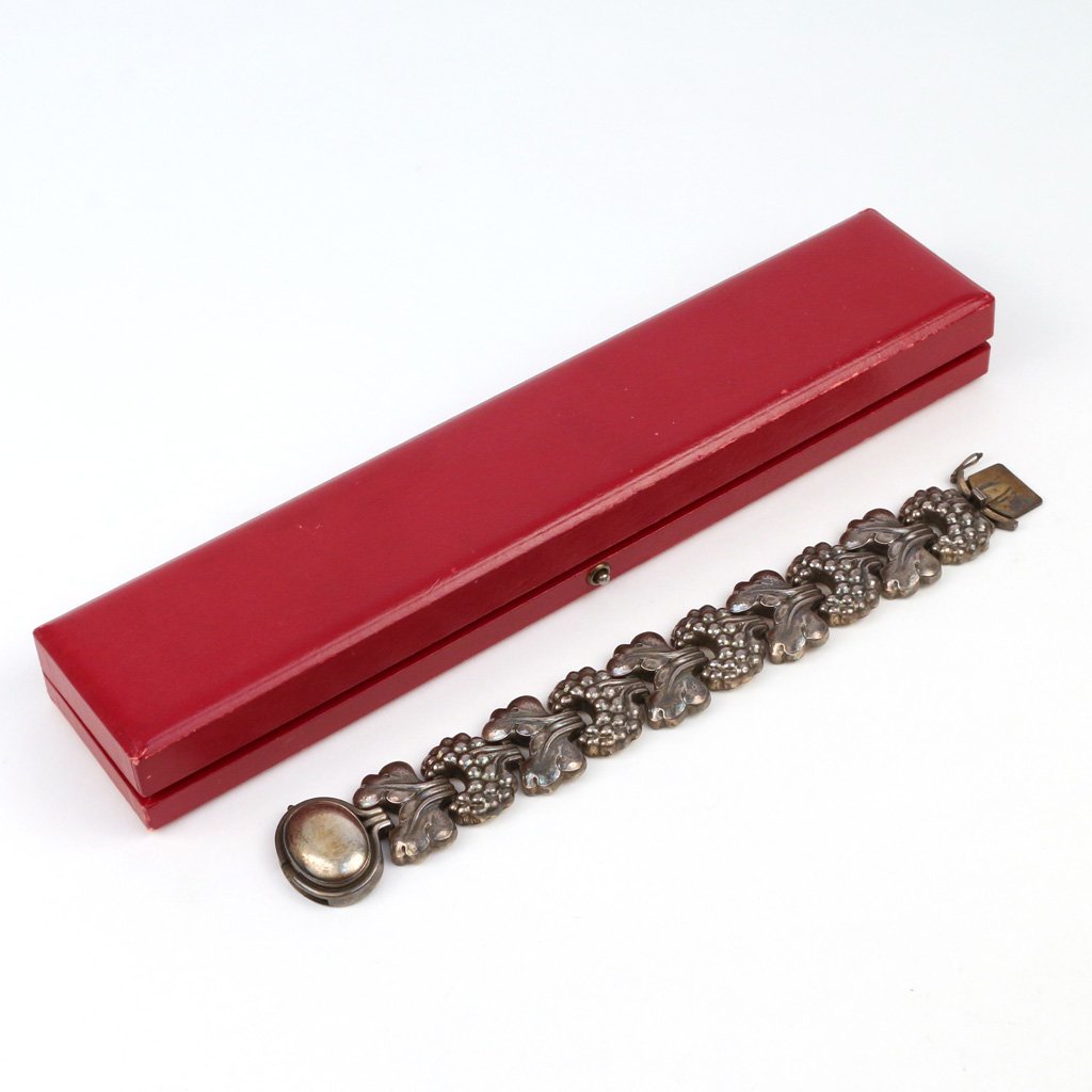 GEORG JENSEN STERLING SILVER BRACELET: having a linked grape-and-grape leaf motif, mkd. 'Georg Jensen / Sterling / Denmark / 30', 7 1/2 in., approx. 2 toz, w/orig. box