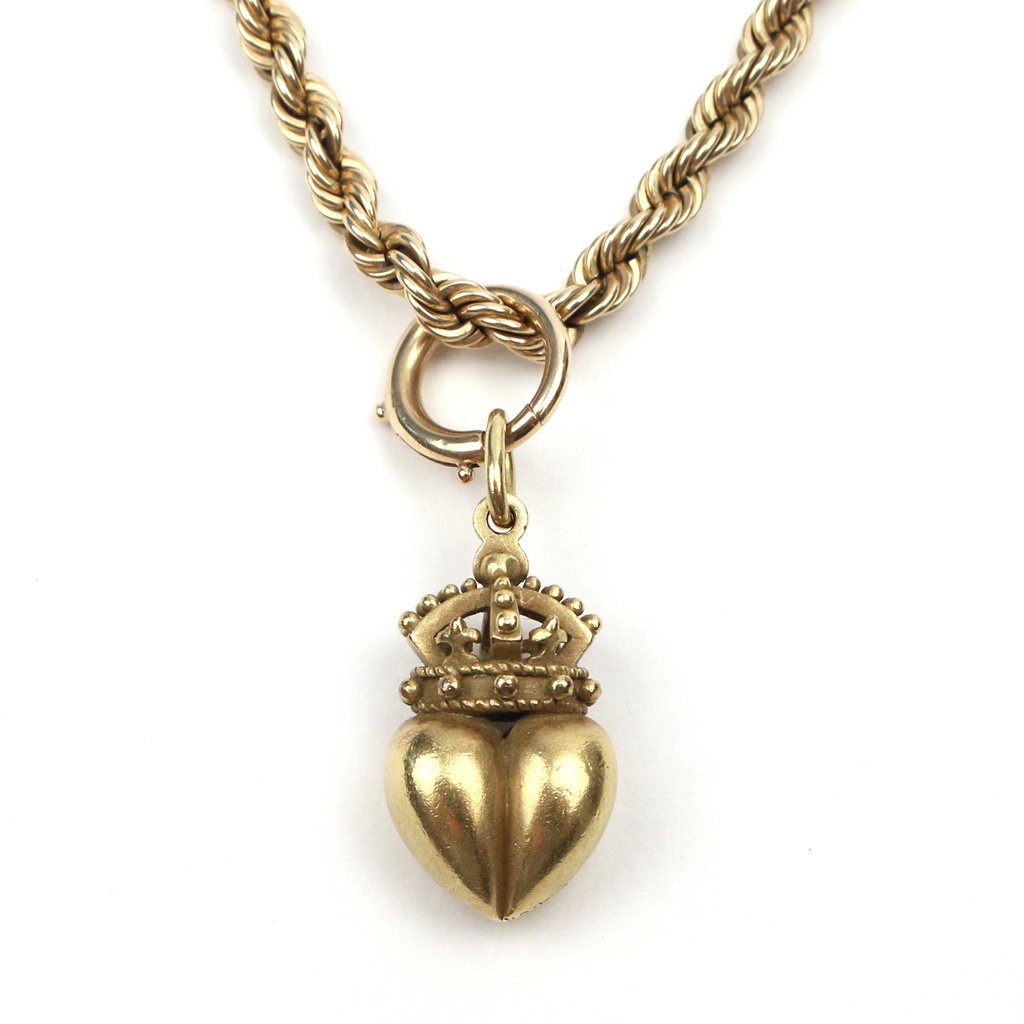 18k GOLD BARRY KIESELSTEIN-CORD PENDANT: of heart and crown shape, mkd. 'B. Kieselstein-Cord / 1981 / 18k', h. 1 in., 13.2 gms, with a 14k gold rope chain, with toggle mkd. '14k', 15.5 gms, 16 in. long; Provenance (pendant): Sotheby's Arcade