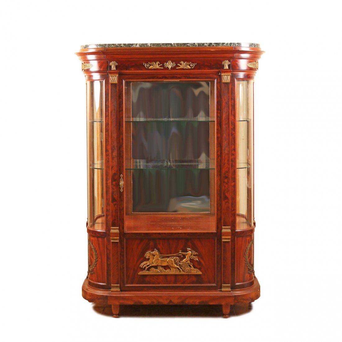 MAISON KRIEGER ORMOLU-MOUNTED MAHOGANY VITRINE: French, 19th Century, in the French Empire style, with a vert maurin marble top above a molded cornice and frieze with griffon and bushel mounts above a glazed door with a lower panel having a large m