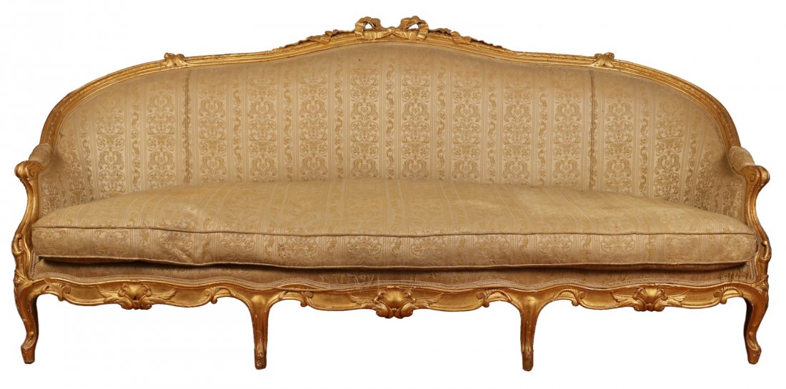 ITALIANATE GILT CARVED CANAPE: L.18/E.19thC., h. 39" w. 88" d. 33", with recent gilding. Slight crack in one footing. Upholstery worn in some spots.