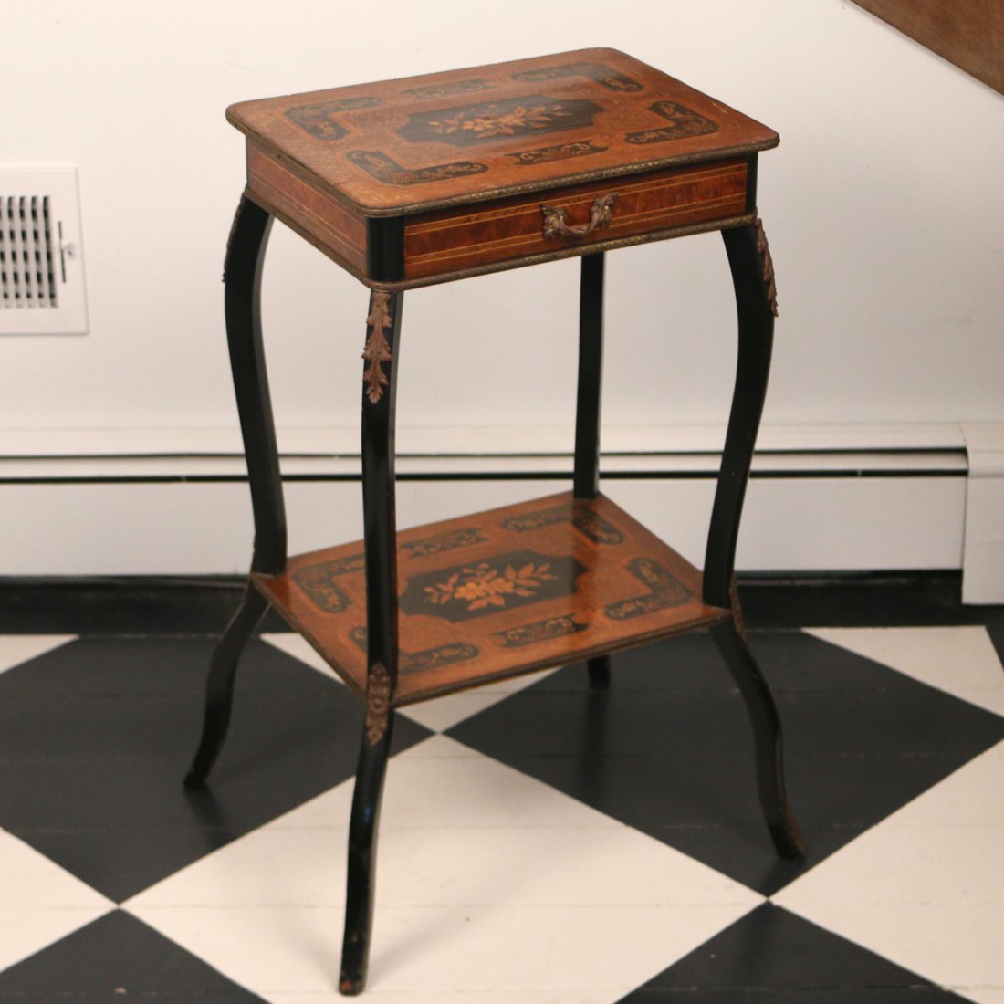 CONTINENTAL INLAID TULIPWOOD STAND: 19th Century, having a single drawer and a lower shelf, brass bindings and ormolu mounts, h. 30", w. 16", d. 12", with wear